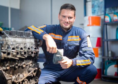Professional car mechanic in repair shop.