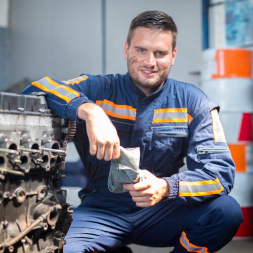 Professional car mechanic in repair shop.